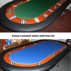 May include: Two oval-shaped poker tables with black felt and wooden edges. The table at the top has a green felt insert and the table at the bottom has a blue felt insert. Both tables have cup holders around the edge.