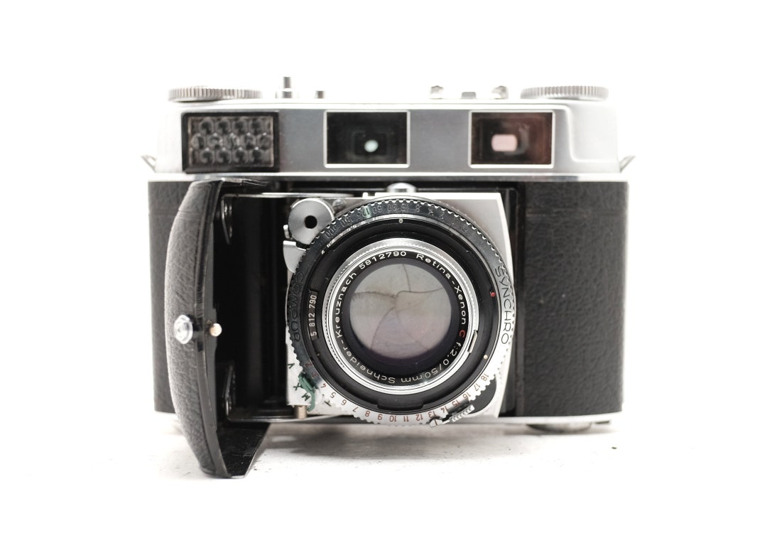 A Kodak Retina Reflex III camera with Schneider-Kreuznach Retina-Xenon F:1.9/50mm lens, together wit A Kodak Retina Reflex III camera with Schneider-Kreuznach Retina-Xenon F:1.9/50mm lens, together wit