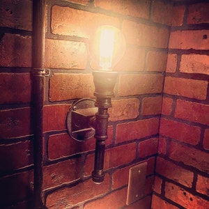 Steampunk Streamline Upright Wall Sconce industrial light. Cast iron rustic wall art.