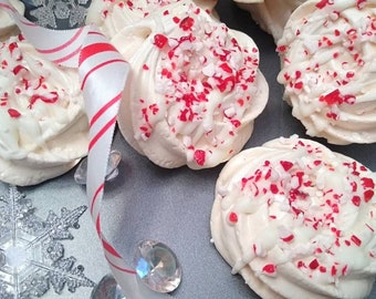 12 Absolutely Delicious Vanilla Meringue Cookies Drizzled in White Chocolate and Crushed Candy Canes