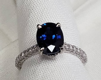 Vibrant and genuine deep blue sapphire and diamond ring weighing 3.19ct set in a gorgeous custom 14k white gold ring with .55ct diamonds