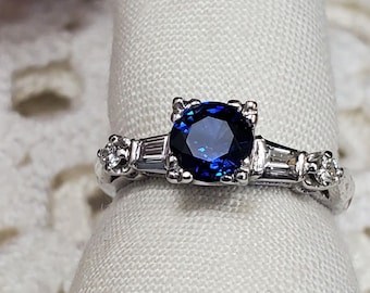 Antique platinum and diamond mounting with a Modern cut Newly set Ceylon sapphire