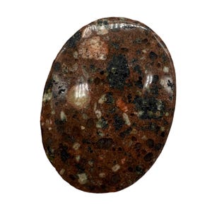 May include: A polished, oval stone with a mottled pattern. The stone features a mix of colours, including deep red, black, green, and cream. The surface is smooth and reflective, with a natural, earthy appearance. The stone is likely a decorative or collectible item.