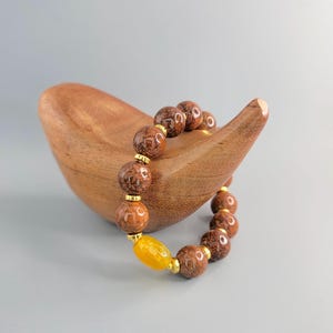 Pulsera de cuentas de piedras preciosas: Cuenta central de dragón de ágata facetada, jaspe fuegos artificiales