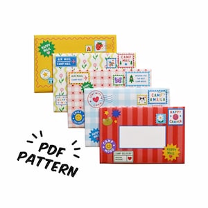 May include: Five rectangular envelopes featuring colorful patterns and decorative postage stamp designs. The envelopes include yellow, floral, pink gingham, blue gingham, and red striped designs with text like HAPPY MAIL and CAMP MAIL. PDF PATTERN text is visible.