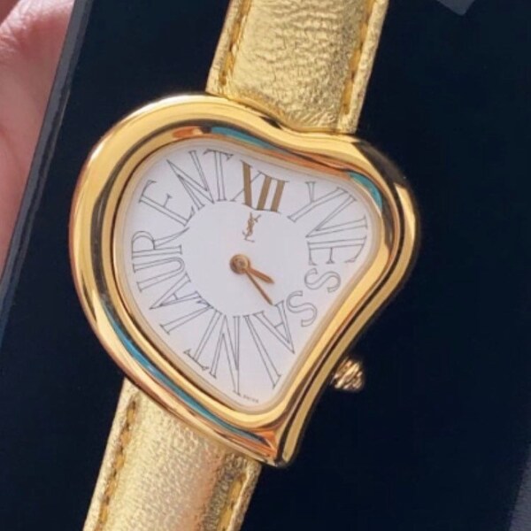 Authentic Yves Saint Laurent 1990s heart YSL gold tone love watch gold  leather band Genuine Brand NEW in Box serial no 27619 made in France