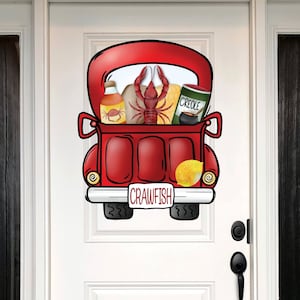 May include: A red pickup truck with a crawfish, a bottle of hot sauce, a lemon, and a pot of gumbo in the back. The truck has a license plate that says "Crawfish".