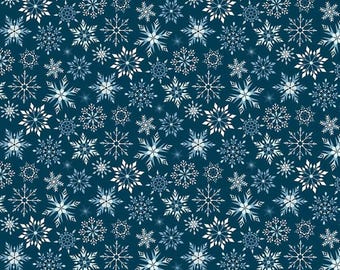 May include: A fabric with a repeating pattern of white and light blue snowflakes on a dark blue background. The snowflakes vary in size and design, creating a wintery or holiday theme. The fabric is measured in inches.