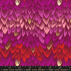 May include: A fabric print featuring a repeating pattern of overlapping petal or feather shapes in shades of magenta, deep purple, and bright red, with occasional gold accents. A black ruler at the bottom shows 7 inches of the Ruby Star Society brand.