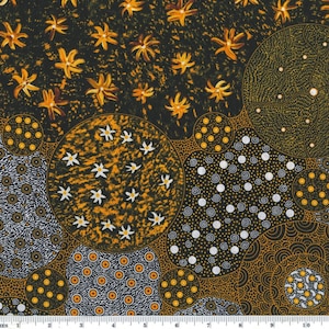 May include: Abstract fabric with a black background and a pattern of yellow flowers, white dots, and swirls. The fabric has a textured look and feel.