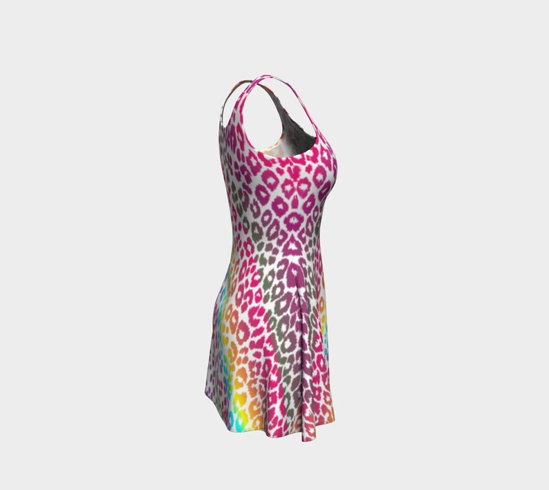 May include: A sleeveless dress with a rainbow leopard print pattern. The dress has a fitted bodice and a flared skirt.