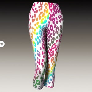 May include: Rainbow leopard print leggings with a white background. The leggings are cropped and have a fitted silhouette.