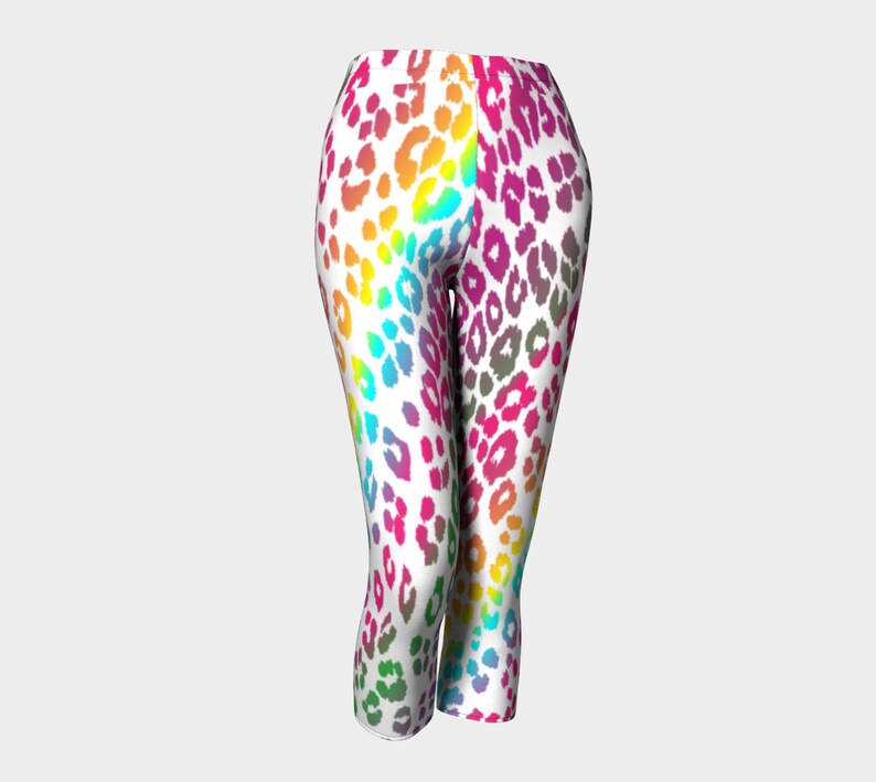 May include: White leggings with a rainbow leopard print pattern.