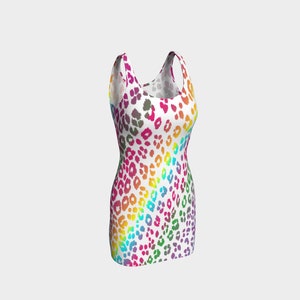 May include: A sleeveless mini dress with a white background and a rainbow leopard print pattern.