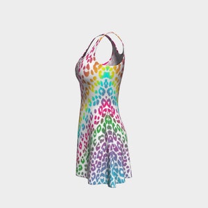 May include: A sleeveless dress with a rainbow ombre pattern and a leopard print design.