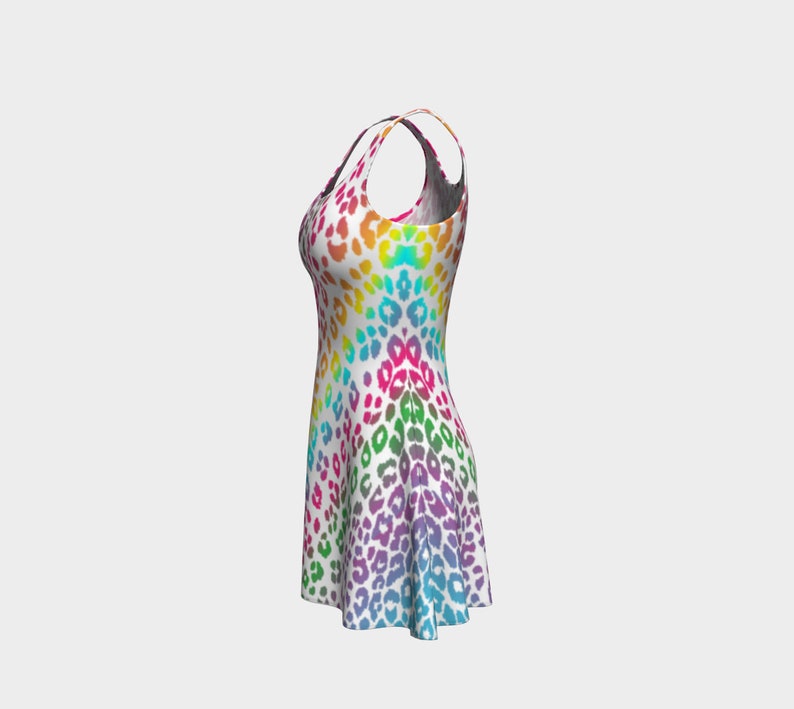 May include: A sleeveless dress with a rainbow ombre pattern and a leopard print design.