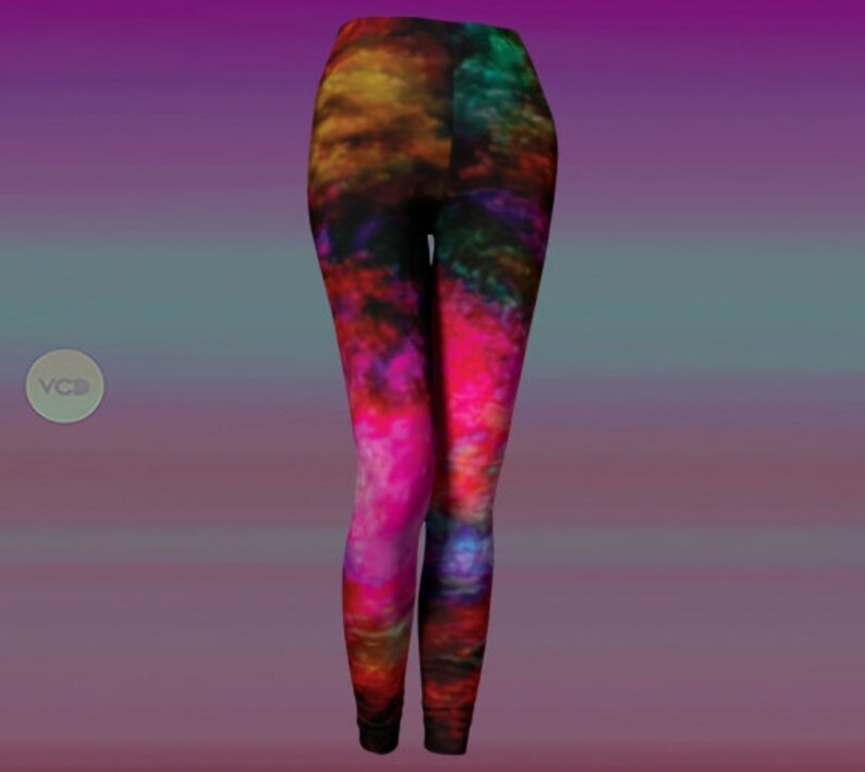 May include: A pair of leggings with a colorful abstract print featuring shades of pink, red, orange, yellow, green, and blue. The print resembles a nebula or galaxy.