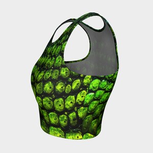 May include: Green and black crop top with a scaly pattern.