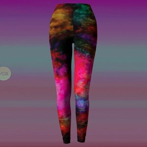 May include: A pair of leggings with a colorful abstract print featuring shades of pink, red, blue, and yellow.