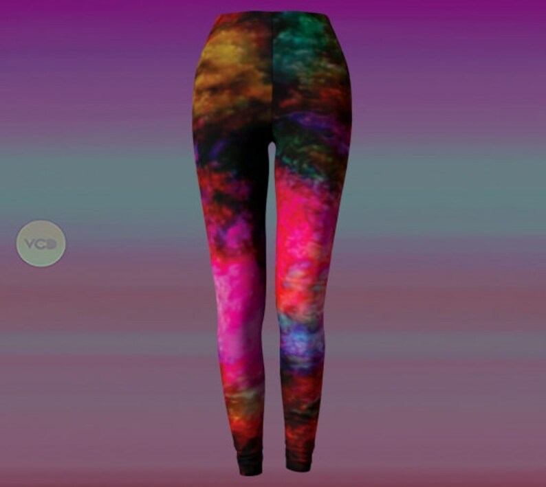 May include: A pair of leggings with a colorful abstract print featuring shades of pink, red, blue, and yellow.