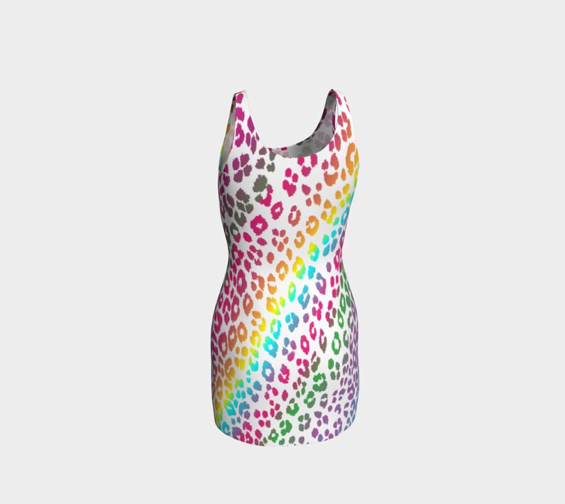 May include: A sleeveless dress with a white background and a rainbow leopard print pattern.