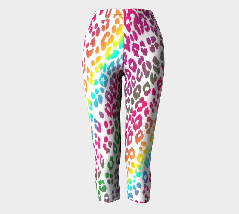 May include: Rainbow leopard print leggings with a white background. The leggings are cropped and have a fitted silhouette.