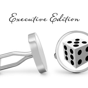 May include: Silver cufflinks with a white background and a black dice graphic. The cufflinks are labeled "Executive Edition".