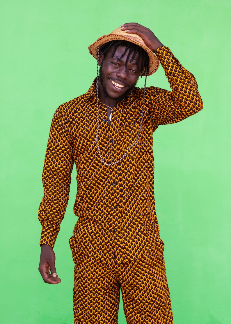 Long sleeve men shirt with African wax print made from cotton.