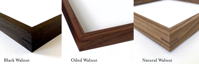 May include: Three wooden picture frames in different finishes: black walnut, oiled walnut, and natural walnut. Each frame is made of solid wood and has a simple, elegant design.