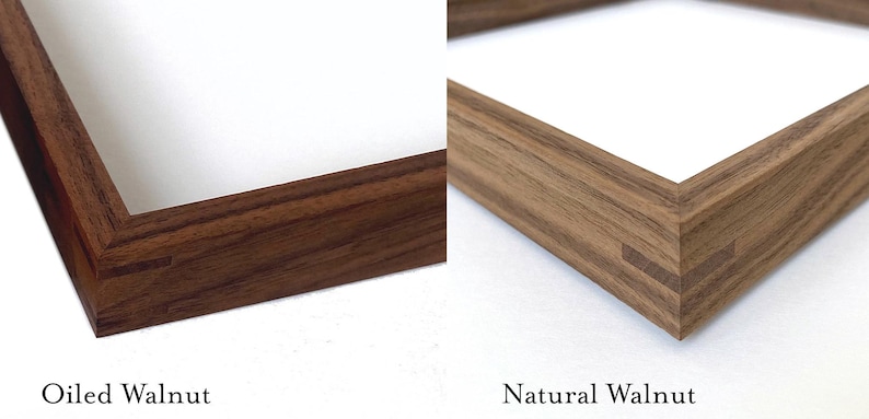 May include: Close-up of two wooden picture frames, one with a natural walnut finish and the other with an oiled walnut finish. Both frames have a simple, rectangular design with mitered corners.