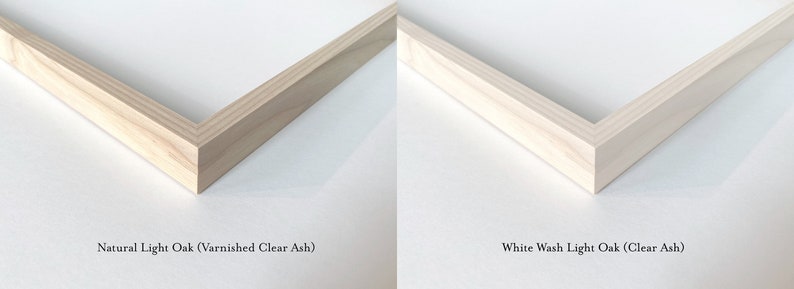 May include: Close-up of two wood picture frames, one with a natural light oak finish and the other with a white wash light oak finish. Both frames are made of clear ash wood.