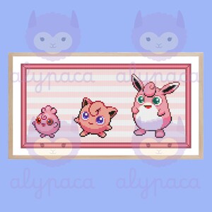 May include: A pixel art cross-stitch pattern featuring three pink Pokemon: a large Jigglypuff, a smaller Wigglytuff, and a tiny Igglybuff. The pattern is framed in a light brown wood frame.