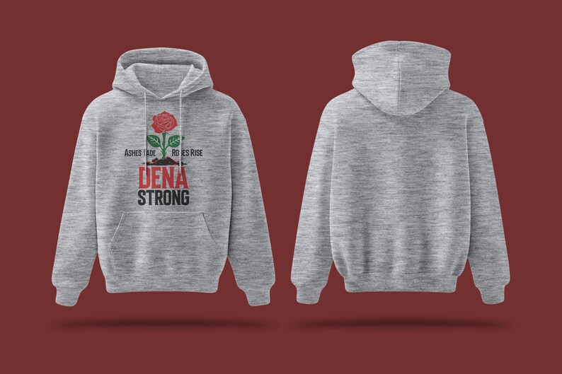 May include: A gray hooded sweatshirt with the text "Ashes Fade, Roses Rise" and "Dena Strong" printed on the front. A red rose with green leaves is printed above the text.