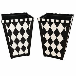 May include: Two black and white decorative planters. Each planter has a square top and a tapered shape. The exterior features a repeating pattern of black and white diamonds. The top rim has a black and white checkerboard design.