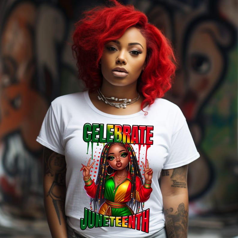 May include: White t-shirt with the words "CELEBRATE JUNETEENTH" in green and red. The shirt features a cartoon illustration of a Black woman with braids, wearing a red, green, and yellow outfit, making a peace sign.