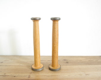 Vintage pair of tall wooden spools with metal ends, old spinning spool, textile mill wood bobbin, Industrial primitive interior design