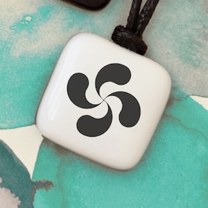 Lauburu pendant. Mythological Basque symbol. Symbol of protection that drives away the influence of evil. Basque symbols. Symbol good omen