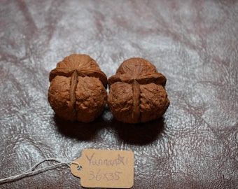 Matched Three-Faced Yunnan Iron Wenwan Walnut Hand Rubbing Pair Top Grade (36x35mm)