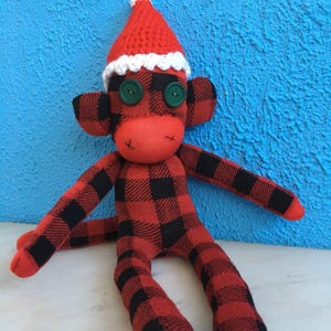 Plaid Santa Claus Sock Monkey wearing a Santa Hat, Christmas, Woodland, Winter, Holiday