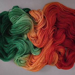 Sunset Fields | Hand dyed | hand-dyed yarn | hand dyed yarn | hand dyed sock yarn | sock yarn | orange yarn | orange and green variegated
