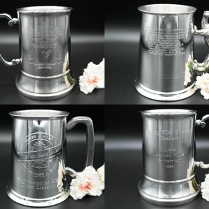 May include: Four silver pewter tankards with different engravings. The tankards have a lion head handle and a round base. The engravings include a soccer team logo, a list of names, a birthday message, and a soccer team logo with a banner.