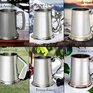 May include: Six different pewter tankards with various handle designs. The tankards are all silver in color with different colored accents. The tankards are labeled "Pewter Antique", "Pewter Lion", "Pewter Brass", "Pewter Golf", "Pewter Fancy", and "Pewter Copper".