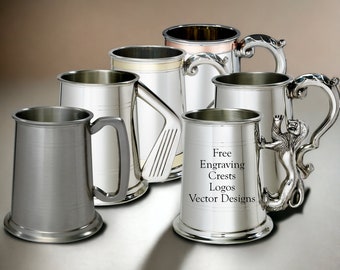 May include: A collection of six pewter tankards with various handle designs. The tankards are silver in color and have a polished finish. The text "Free Engraving Crests Logos Vector Designs" is printed on the front of one of the tankards.