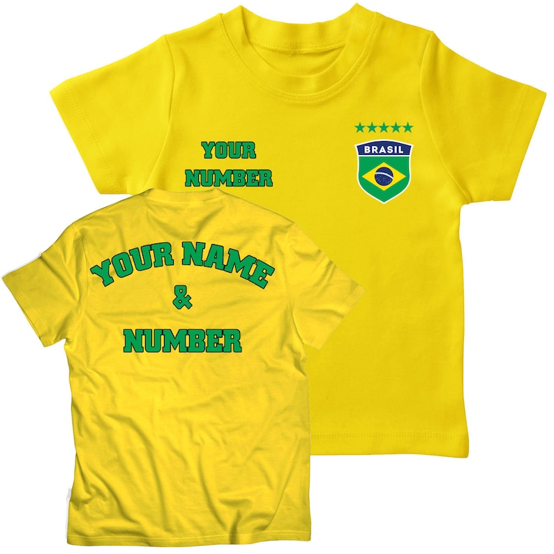 May include: Yellow soccer jersey with green and blue details. The front of the jersey has the text "YOUR NUMBER" and a small patch with the text "BRASIL" and five stars. The back of the jersey has the text "YOUR NAME & NUMBER" in green.