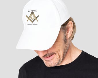 May include: White baseball cap with a gold Masonic symbol and the text "St. John's" and "James Adams".