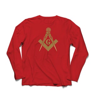 May include: Red long-sleeve t-shirt with a gold Masonic symbol, featuring a compass and square with a 'G' in the center.