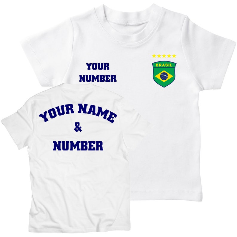 May include: White t-shirt with a blue "YOUR NAME & NUMBER" text on the back and a blue "YOUR NUMBER" text and a green and yellow Brazil crest on the front.