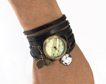 Charm watch with vintage-style dial in bronze tone on black leather gift idea for young girls at the end of the school year