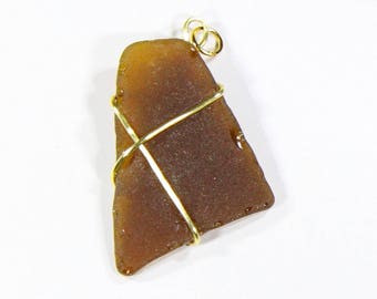 Brown sea-glass pendant wrapped in golden wire