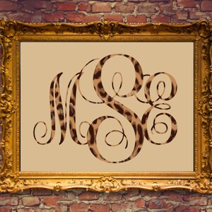 May include: A gold-framed picture with a beige background featuring a monogram of the letters "M.S.E." in a leopard print pattern.